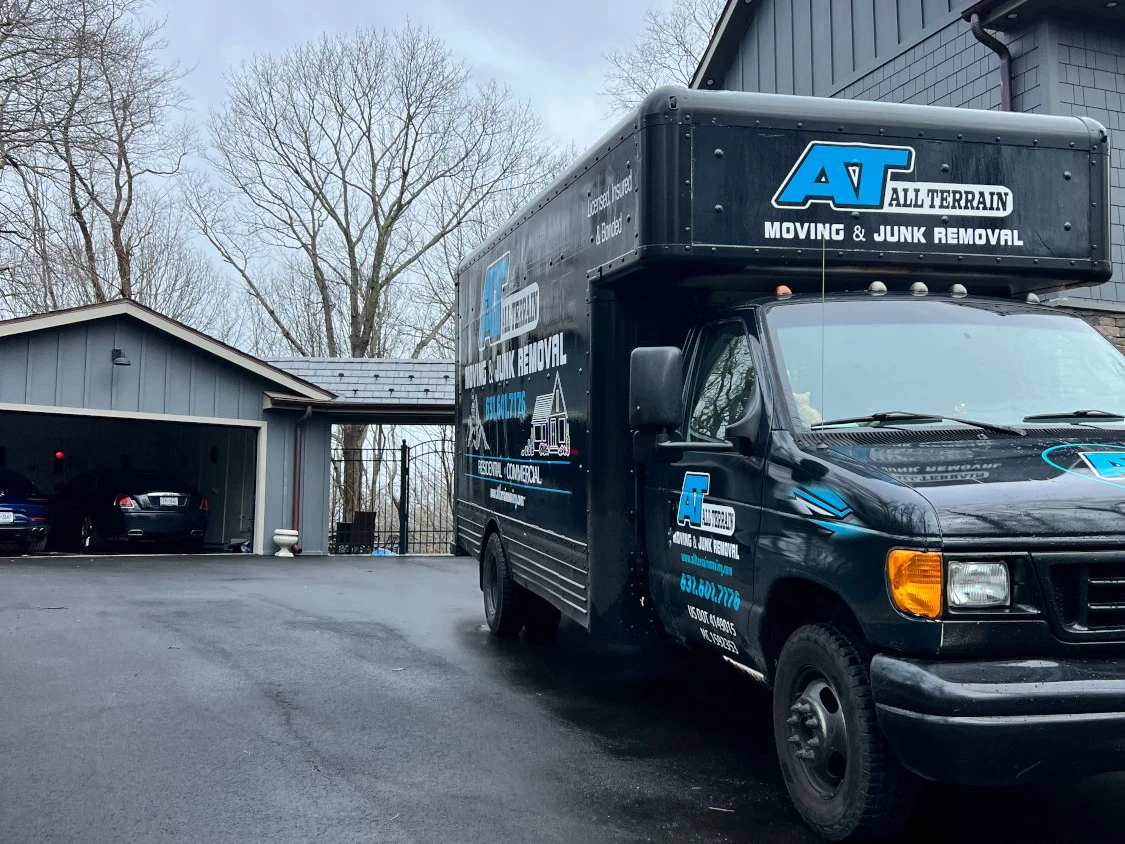 All Terrain's junk removal service van in driveway on Long Island