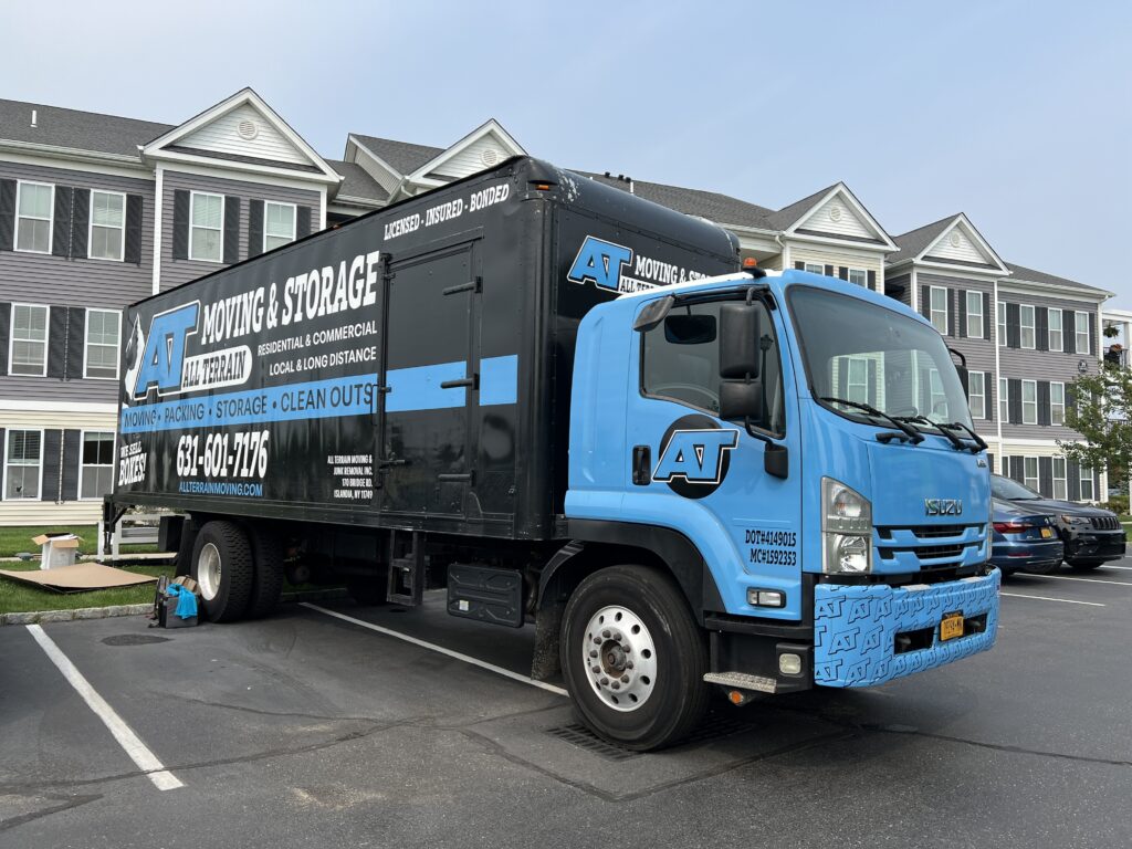 Moving truck parked outside apartments