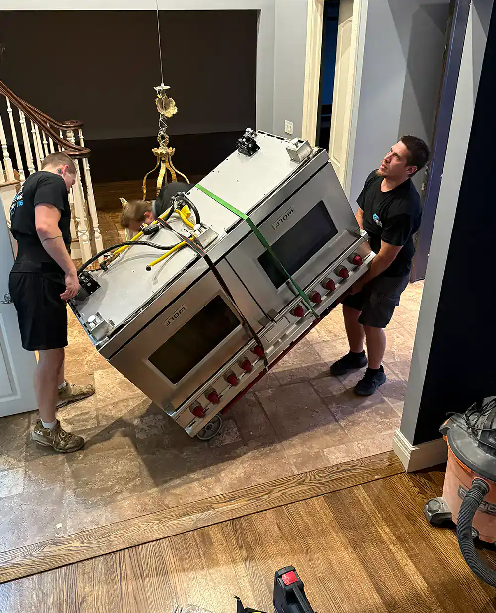Heavy appliance moving service for kitchens and commercial spaces.